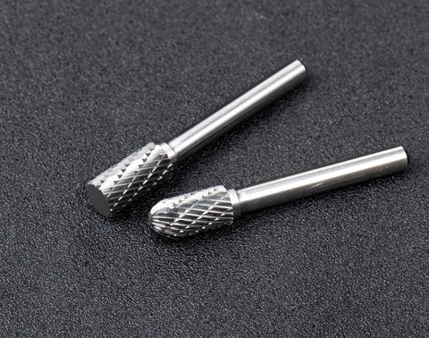 Close-up of 10 piece carbide burr set for metalwork with 1/4 inch shank, ideal for metal shaping and engraving.