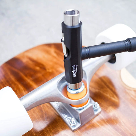 Reds Bearings 608 Set with Stoked Tool on skateboard wheel for smooth spins, tight tolerances, grind ready performance