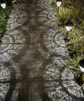 Bright Solar Pathway Lights 4 Pack Outdoor Waterproof Crackle Glass Aluminum Stake Lights illuminating wooden pathway at night