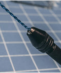 Close-up of Pro Grade Precision Pin Vise Hand Drill Kit With Twist Bits for Miniature Models, featuring a blue twist bit.