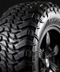Trail Blade MTS Mud Terrain Radial Tire For Light Trucks And Jeeps, 35X13.50R24LT, aggressive tread and black sidewall, close-up view