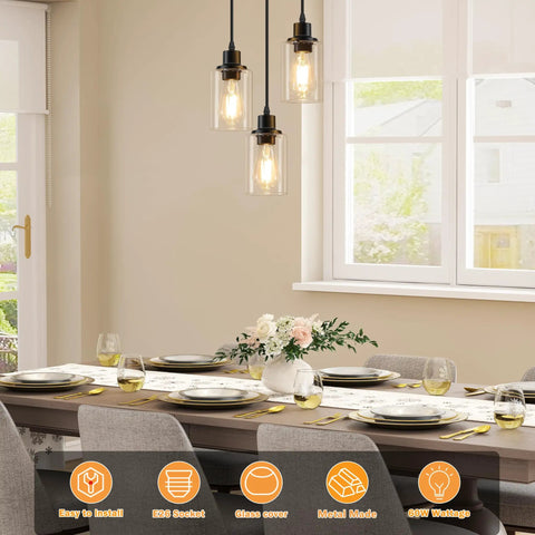 Slick Three Light Black Pendant Fixture With Crystal Clear Glass Shades And Fully Adjustable Suspension Cords above dining table.