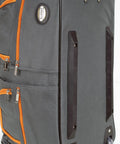 Side view of 22 Inch Polyester Rolling Duffel Bag With Expandable Design, Full Lining And Internal Handle, Charcoal Color, Two Large Front Pockets, Clear Skate Wheels, Ready For Weekend Getaways And Road Trips with orange zippers.