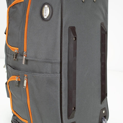 Side view of 22 Inch Polyester Rolling Duffel Bag With Expandable Design, Full Lining And Internal Handle, Charcoal Color, Two Large Front Pockets, Clear Skate Wheels, Ready For Weekend Getaways And Road Trips with orange zippers.