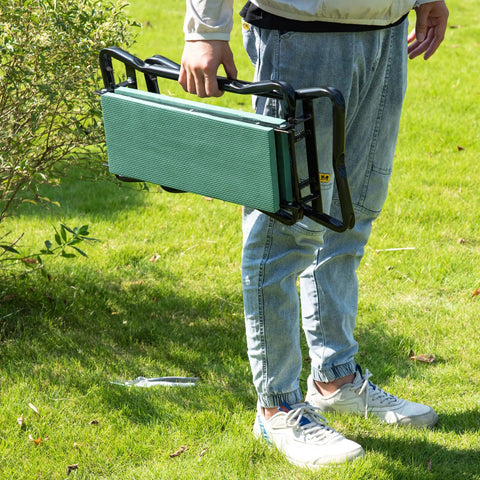 Person holding a folded Padded Garden Kneeler And Seat Bench With Extra Thick Foam, Foldable Steel Frame, Lightweight And Portable.