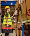 Worker holding a Grab And Go Lockout Tagout Kit With 39 Pack OSHA Compliant Locks And Red Double Decker Toolbox in a warehouse.