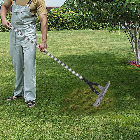 Person using Thatch Rake With 58.5 Inch Adjustable Handle And 15 Inch Steel Head For Lawn Care And Yard Work, Debris Removal, And Thatch Removal