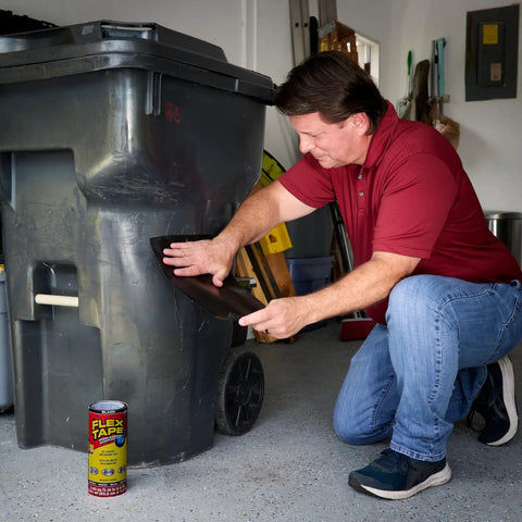 Man applying Heavy Duty Thick Rubberized Waterproof Tape For Patching Leaks And Sealing Cracks Indoors Or Outdoors Works Underwater Bonding Patching And Repair On Roofs Plumbing RVs And Pools Black 8 In By 5 Ft Pack Of 2 on trash can