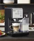 Super Sleek Programmable Espresso And Cappuccino Maker Featuring Automatic Milk Frother And 19 Bar Pump Stainless Steel Build, brewing coffee on a countertop with milk.