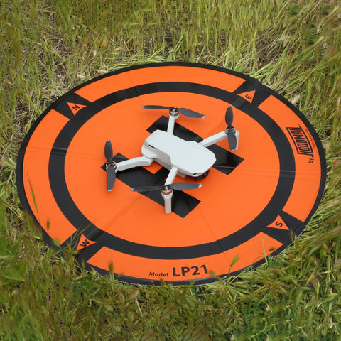 Weighted Trifold UAV Drone Landing Pad LP21 Fits Mini 4 Pro Mini 3 Pro Mavic Spark on grass demonstrating stability