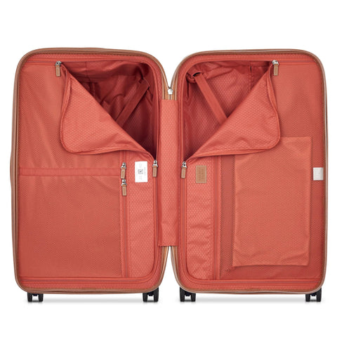 Open interior view of Delsey 26-inch spinner luggage showing compartments and organizer pockets, ideal for travel and packing efficiency.