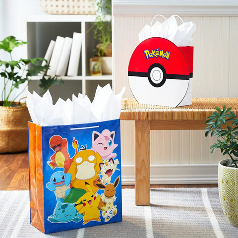 Two Pack Pokemon Gift Bags Bundle 9 Inch Pokeball and 15 Inch Extra Large Pikachu Bags for Kids Teens Gamers displayed on bench