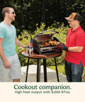 Two men using Portable Stainless Steel Gas Grill With Locking Lid For Easy Transport 8000 BTU Propane Grill with food on grill