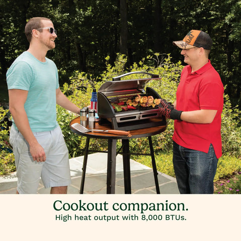 Two men using Portable Stainless Steel Gas Grill With Locking Lid For Easy Transport 8000 BTU Propane Grill with food on grill