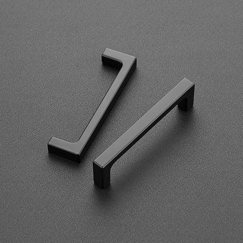 Knockout Matte Black Square Cabinet Handles With Hella Durable Solid Build And Zero Fuss Installation For Modern Kitchen And Bathroom Storage Upgrade Top Shelf 30 Pack Set on textured surface.