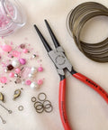 Long Nose Pliers With Round Tips, 6.25 Inch, Precision Grade Tool With Ergonomic Comfort Grip and Steel Construction beside craft supplies.