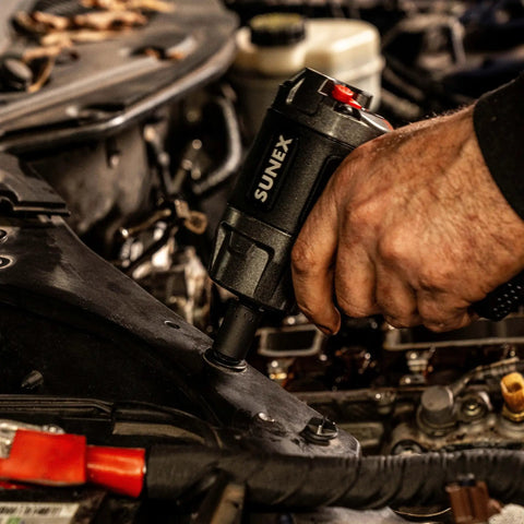 Mechanic using Three Eighth Inch Drive Impact Socket Set, Beefy 51 Piece Metric And SAE Master Kit with Cr Mo Alloy Steel in workshop