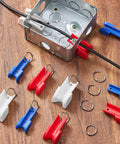 12 Piece Conduit Wire Pulling Grips Set With Open Ring Holders For 1 2 Inch 3 4 Inch And 1 Inch Electrical Cables on wooden surface.