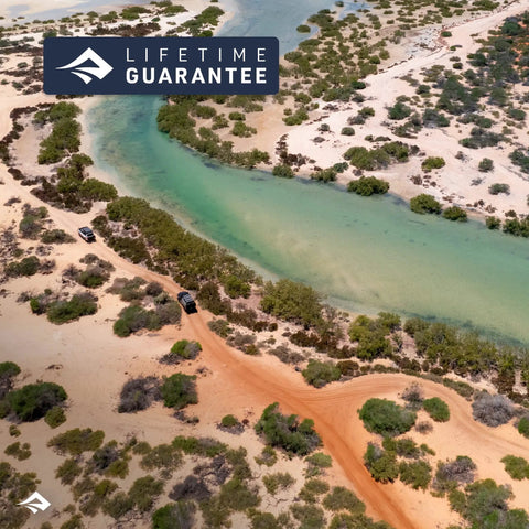 Aerial view of a winding river and sandy landscape with 'Lifetime Guarantee' badge, emphasizing outdoor adventure.