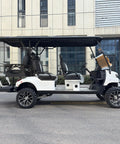 Premium White Six Seater Electric Golf Cart Featuring Hella Roomy Seats And Seamless Pedal Free Operation Driven By A Smooth 48V Lithium Battery Paired With A Powerhouse 5kW Motor For Easy Neighborhood Cruising And Lazy Weekend Hangouts, side view showcasing spacious seats.