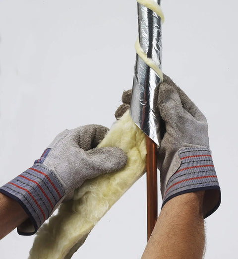 Hands applying Fiberglass Pipe Insulation Kit For All Pipe Sizes With 25 Ft Vapor Barrier And 1.6 R Value, Ideal For Overwrapping Electric Heat Cables
