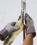 Hands installing foil backed fiberglass pipe wrap 3 inch by 1 inch by 25 feet durable and easy to install heat resistant insulation