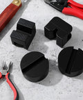Universal Rubber Jack Stand Pads 8 Pack With Round And V Groove Designs Heavy Duty Pinch Weld Protectors on concrete surface.