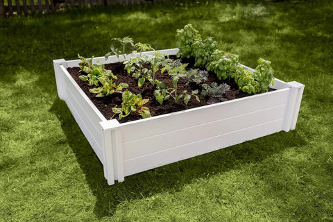 White Vinyl Raised Garden Bed 4 Ft By 4 Ft By 11 In Deep, Modular PVC Construction, BPA And Phthalate Free, Maintenance Free, planted with vegetables