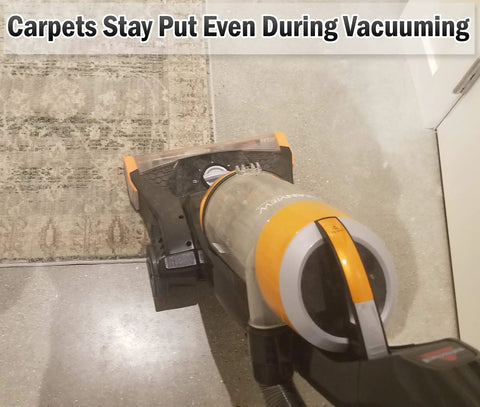 Vacuum using Non Slip Rug Grippers For Every Floor, V Shaped Corner Anti Curling Pads shown holding rug in place on tile floor.
