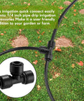 30 Piece Drip Irrigation Tee Connectors for Quarter Inch Tubing Quick Connect Fittings Black Built For Leak Free Connections and Efficient Water Distribution in Your Home Garden Sprinkler Setup installed in grass.