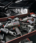 Heavy Duty Half Inch Drive Pneumatic Air Impact Wrench Delivers Over 1100 Ft Lbs Of Bone Crushing Torque on a workshop cart with tools.