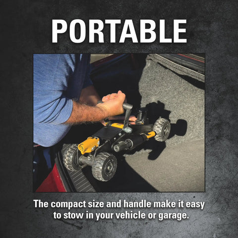 Portable Heavy Duty 2 Ton Cat Wheelie Off-Road Trolley Jack with oversized wheels being stored in a vehicle.