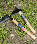 Garden Weeding Sickle Hand Hoe For Weeding And Grass Cutting Japanese Sickle Style Hand Weeder Tool with steel blade on grass