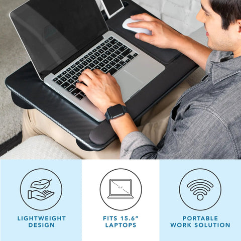 Person using Home Office Pro Lap Desk With Wrist Rest, Mouse Pad, And Phone Holder In Black Carbon Finish for 15.6 inch laptops.