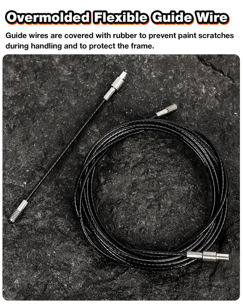 Internal bike cable routing kit: black flexible guide wire with metal ends, coiled on dark surface