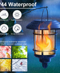4 Pack Solar Powered Flame Wall Lanterns Outdoor Waterproof Sconce Lights with flickering flame design in rain.