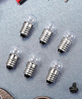 50 Pack E10 Miniature Screw Base Light Bulbs 3.8 Volt 0.3 Amp Mini Pilot Lamps arranged on a silver background.