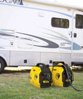 Ultralight 2500-Watt Inverter Generator With Quiet Tech beside RV for camping power backup.