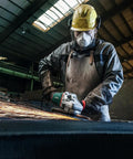 Worker using 7 Inch Angle Grinder With 8500 RPM And 15 Amp Power, Paddle Switch in industrial setting