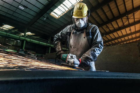Worker using 7 Inch Angle Grinder With 8500 RPM And 15 Amp Power, Paddle Switch in industrial setting