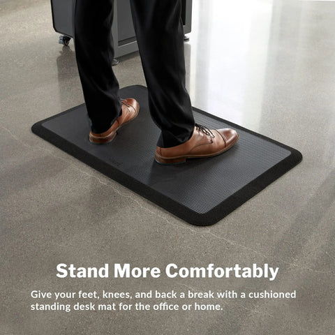 Standing Desk Anti Fatigue Mat 34X22 Inches Cushioned Non Slip Floor Pad for comfort and support, man standing on mat