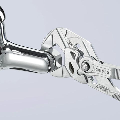 Two-Piece Pliers Wrench Set With Parallel Jaws For Infinitely Variable Gripping holding chrome-plated fitting, smooth jaws shown