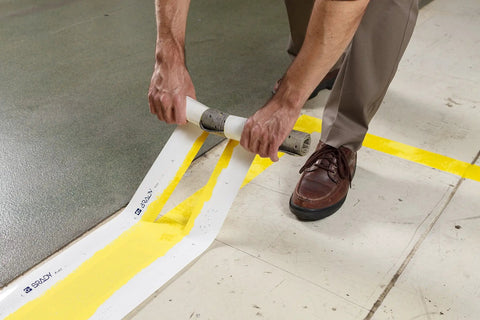 High Adhesion Floor Marking Stencil With Continuous Line For Rough Textured Surfaces, 0.25 In Height, 4 In Width, 1200 In Length, Polyester Clear White, Easy Measuring With Printer Markings For Precise, Clean Paint Lines In Busy Warehouses applied on floor