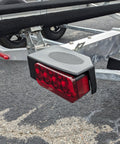 Right Side Waterproof LED Tail Light for Boat Trailer Updated 2025 Model, mounted on trailer frame, 2-way plug visible