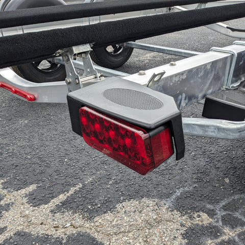 Right Side Waterproof LED Tail Light for Boat Trailer Updated 2025 Model, mounted on trailer frame, 2-way plug visible