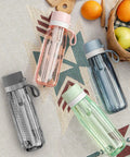 Four GoZero Everyday Water Filter Bottle 22 Oz BPA Free Tritan Plastic Reusable Bottles on a table with fruit and a basket.