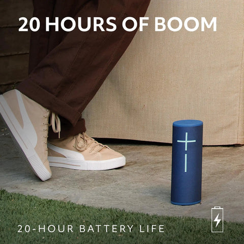 Megaboom 4 Portable Waterproof Bluetooth Speaker with 360° sound, 20-hour battery, shown outdoors next to person's foot.