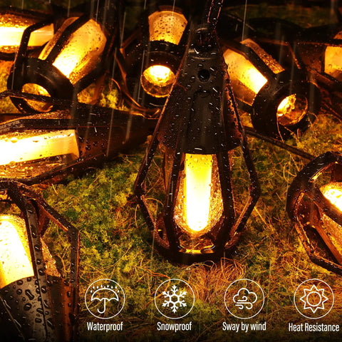 Solar Powered Flickering Flame String Lights For Outdoor Decor 50.7Ft Total Length 15 Warm White LED Bulbs on wet grass