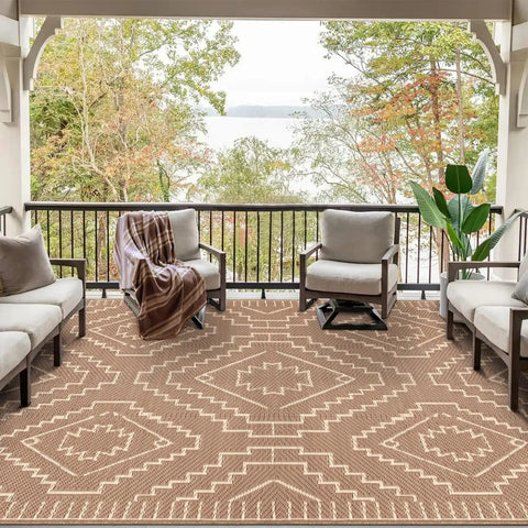 Outdoor Waterproof Plastic Straw Rug 8x10, Reversible Lightweight Carpet for RV Camping, displayed on a patio with beige and brown design.