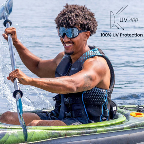Person kayaking wearing Frameless Ultralight Black Mirror Swim Goggles With VisiClear Nanotech Anti Fog Lens And 100 Percent UV Protection